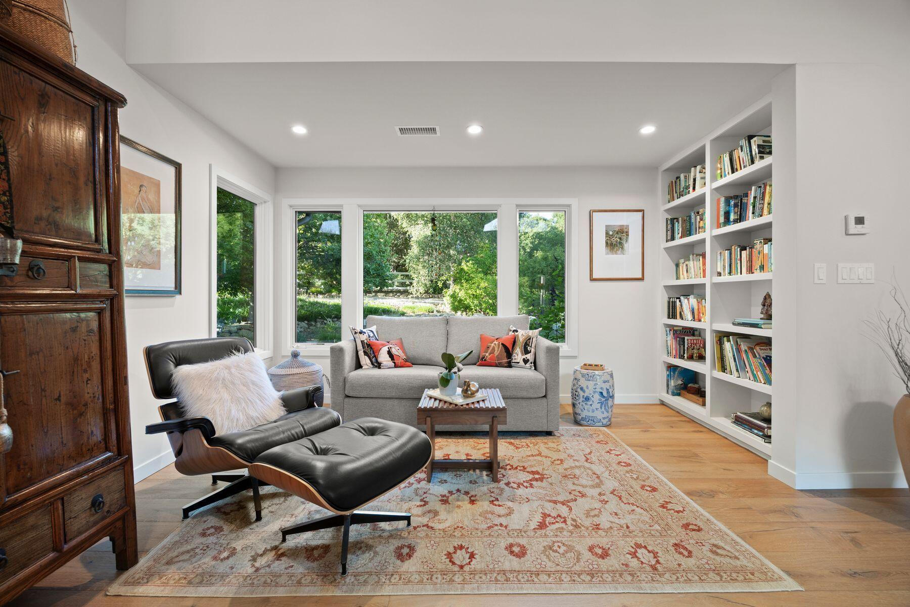 10929 Encino Drive Oak View, CA 93022 - Photo 8 of 50 a living room with furniture and a book shelf