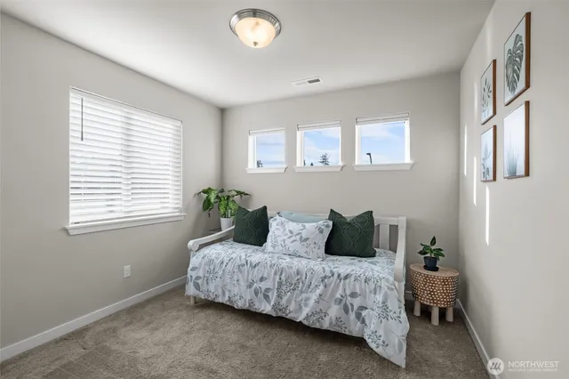 a bedroom with a bed and window