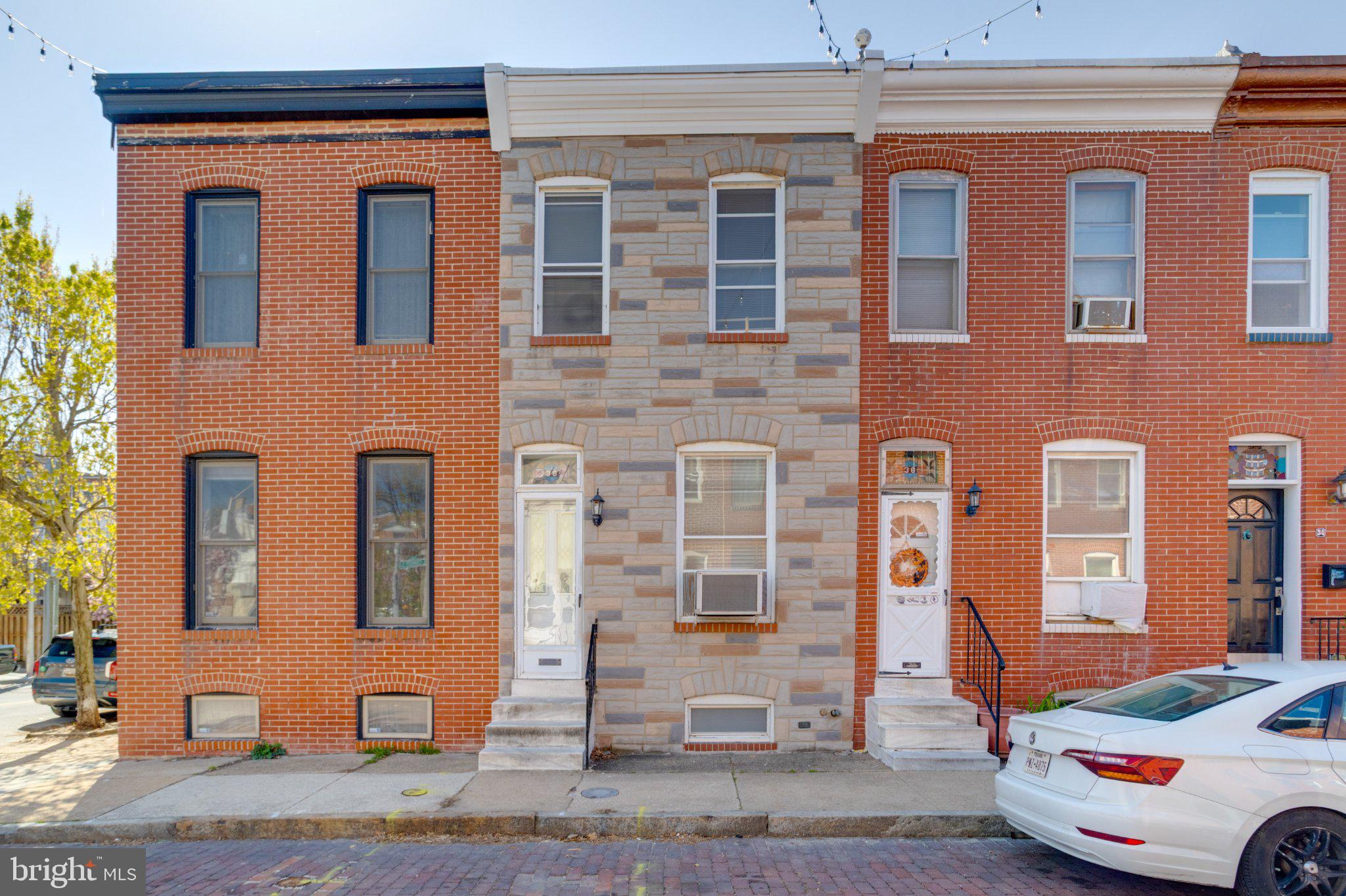 38 South Curley Street Baltimore, MD 21224 - Photo 1 of 38 a front view of a building with a street