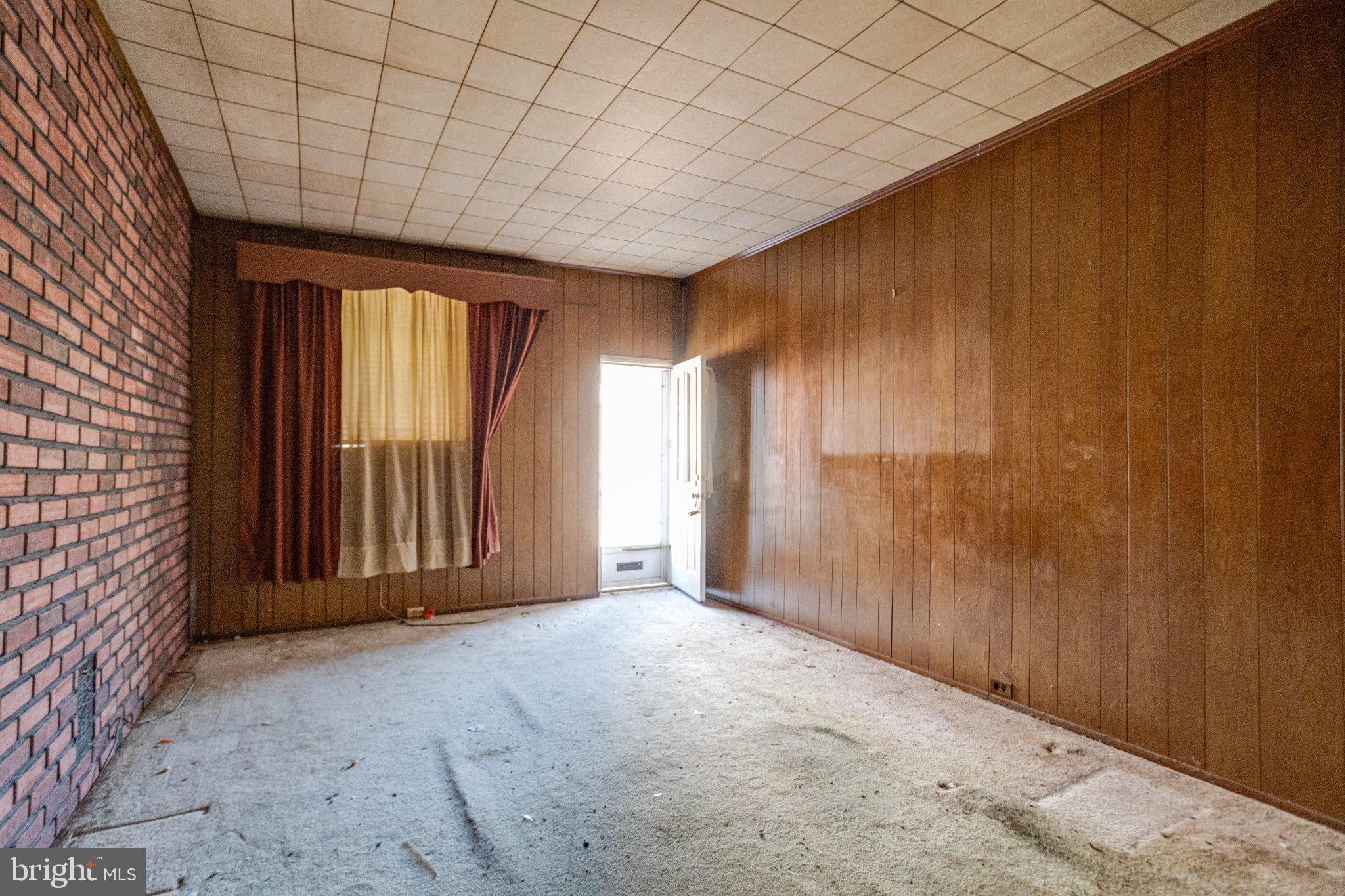 38 South Curley Street Baltimore, MD 21224 - Photo 5 of 38 an empty room with windows