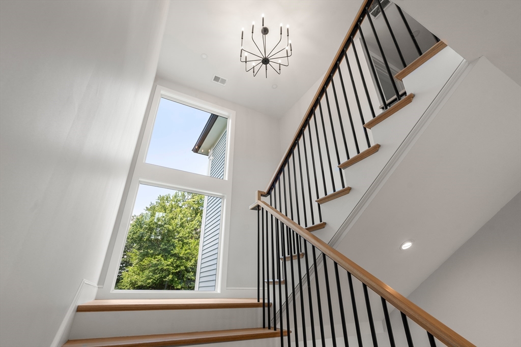 53 Crestview Road Belmont, MA 02478 - Photo 24 of 42 a view of staircase with railing and a large window