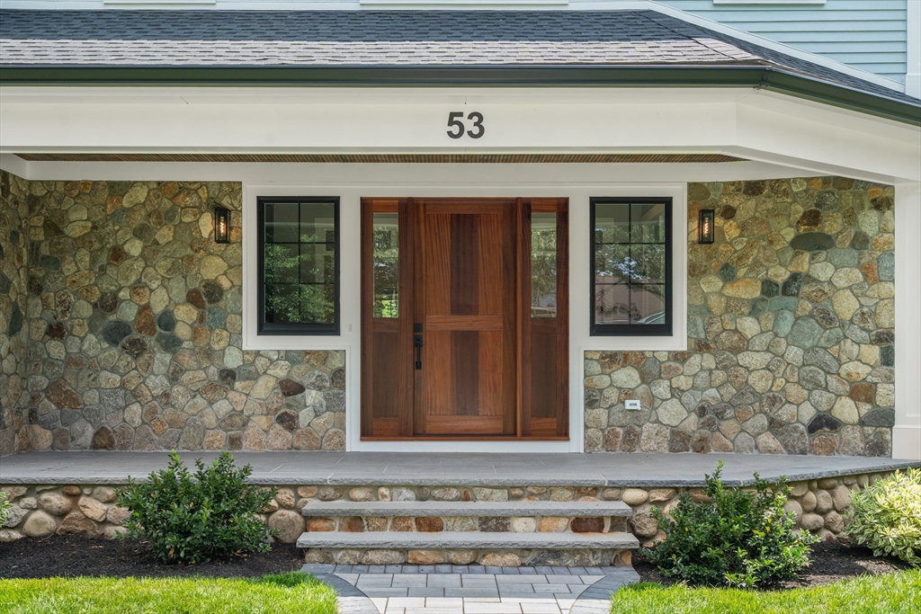 53 Crestview Road Belmont, MA 02478 - Photo 7 of 42 a front view of a house with a yard