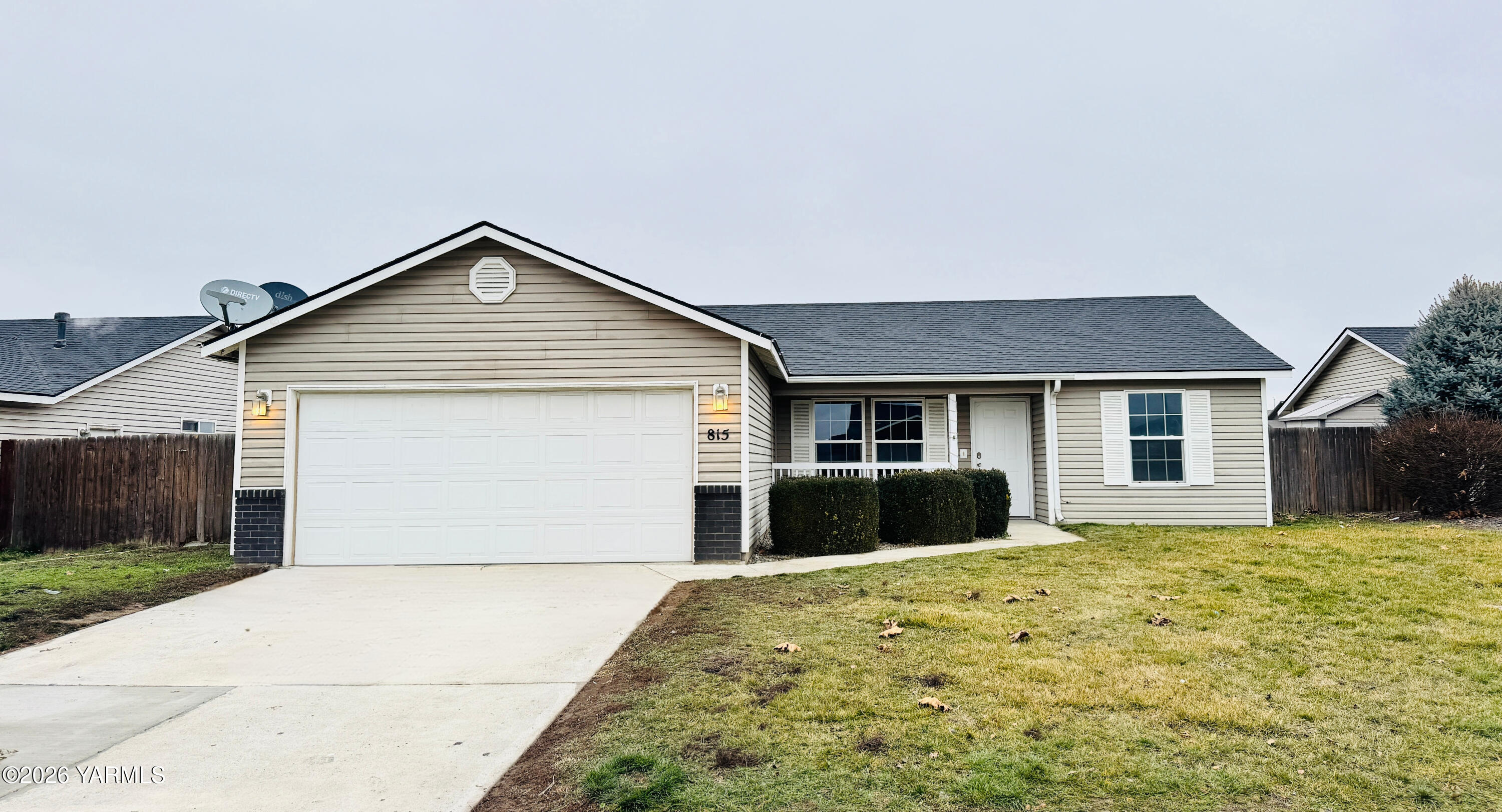 815 Jessica Court Grandview, WA 98930 - Photo 1 of 27 a front view of a house with a yard and garage