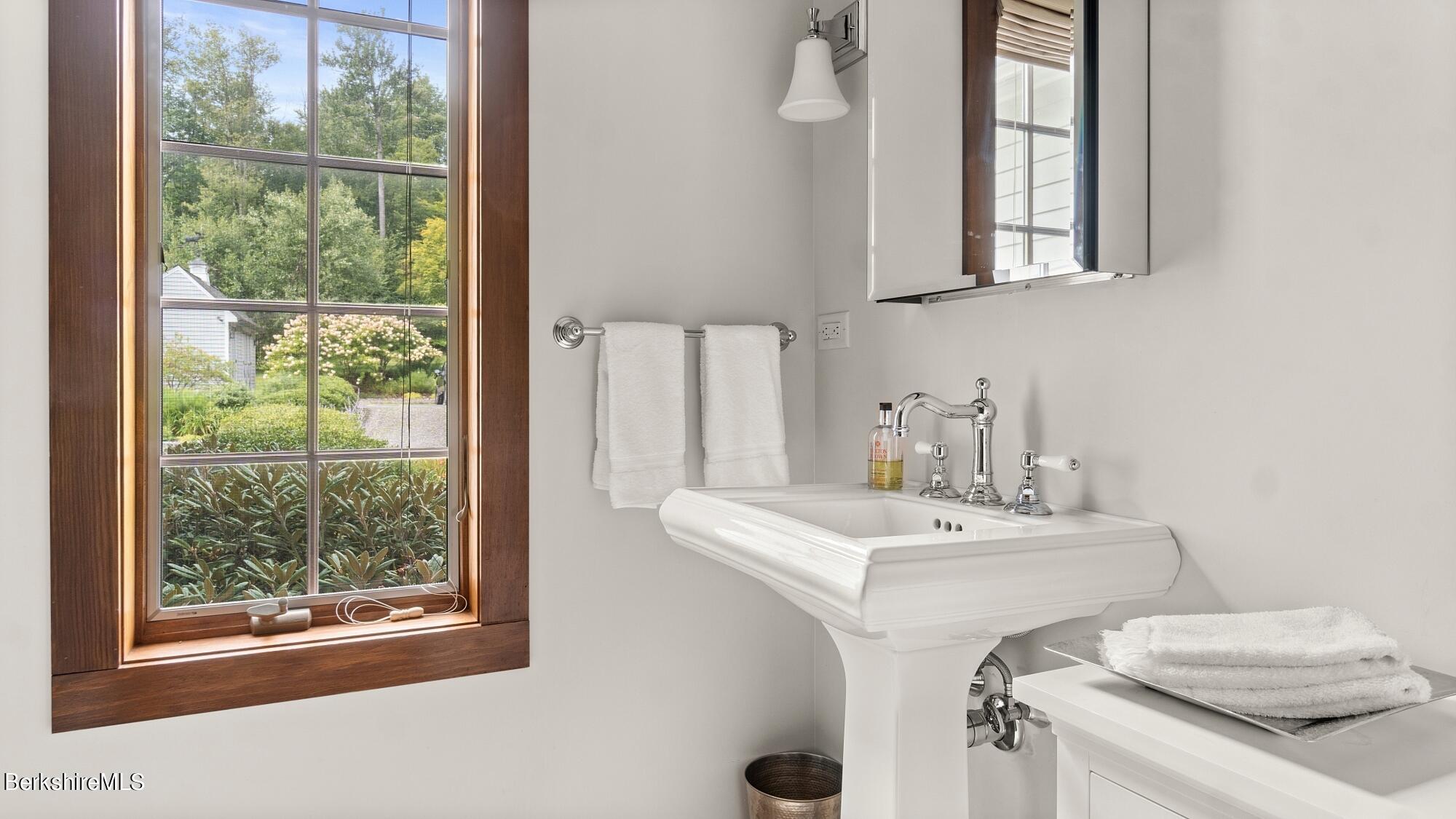 364 Dimmock Road Otis, MA 01253 - Photo 22 of 49 a bathroom with a sink and a mirror