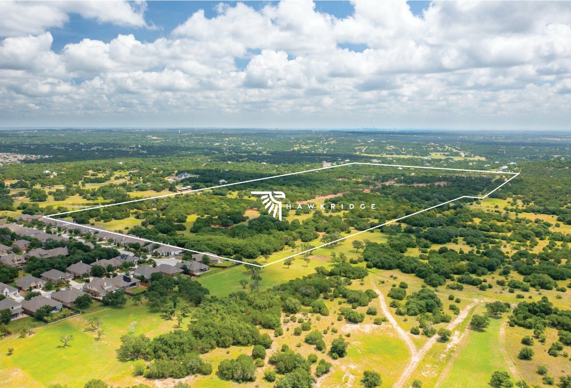0 Broadwing Cove Austin, TX 78737 - Photo 13 of 15 a view of a lake with a city