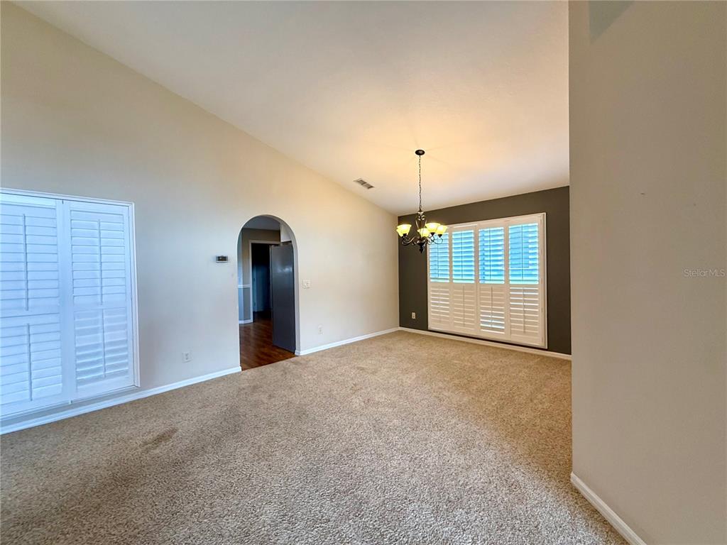 15235 Southwest 14th Avenue Road Ocala, FL 34473 - Photo 11 of 52 a view of an empty room with a window