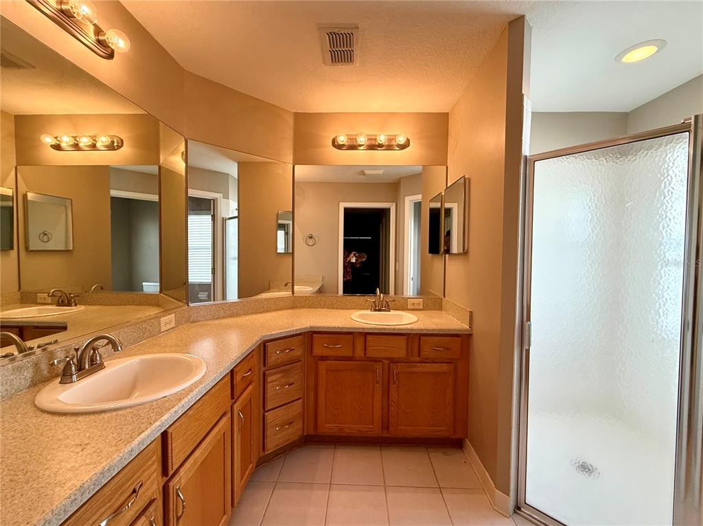 15235 Southwest 14th Avenue Road Ocala, FL 34473 - Photo 23 of 52 a spacious bathroom with a sink double vanity and a mirror