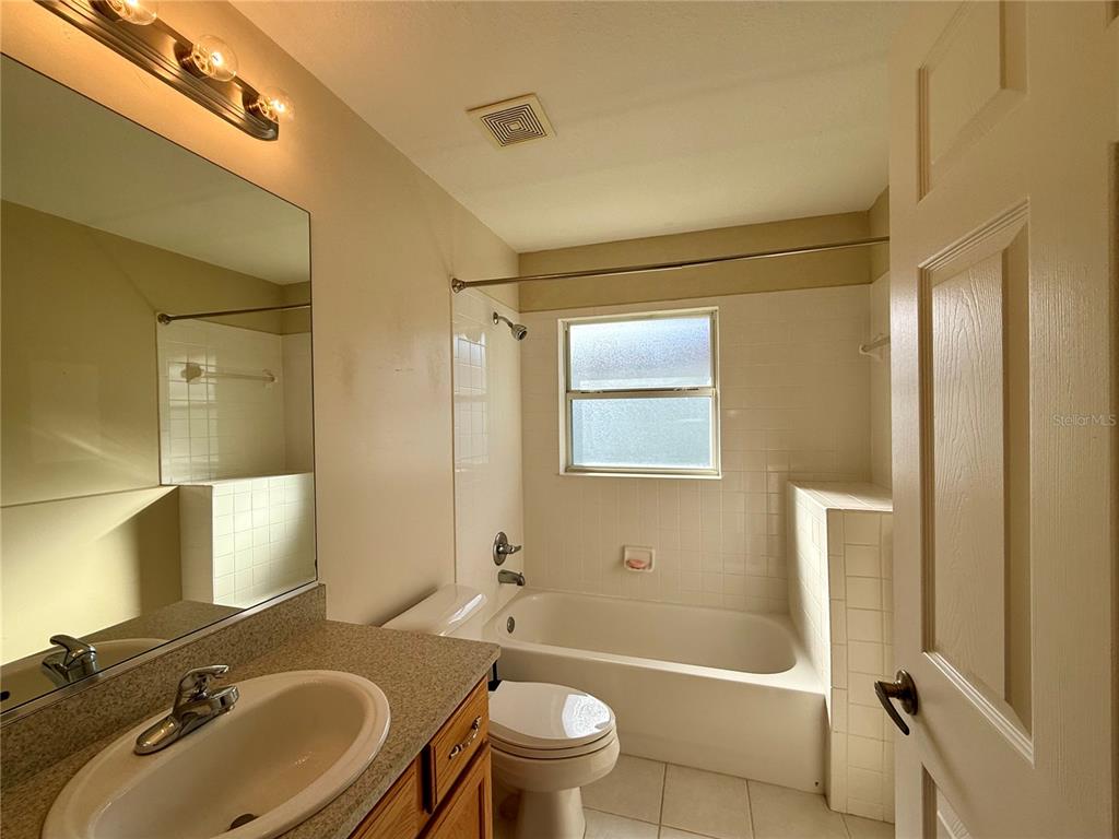 15235 Southwest 14th Avenue Road Ocala, FL 34473 - Photo 30 of 52 a bathroom with a sink toilet tub and shower