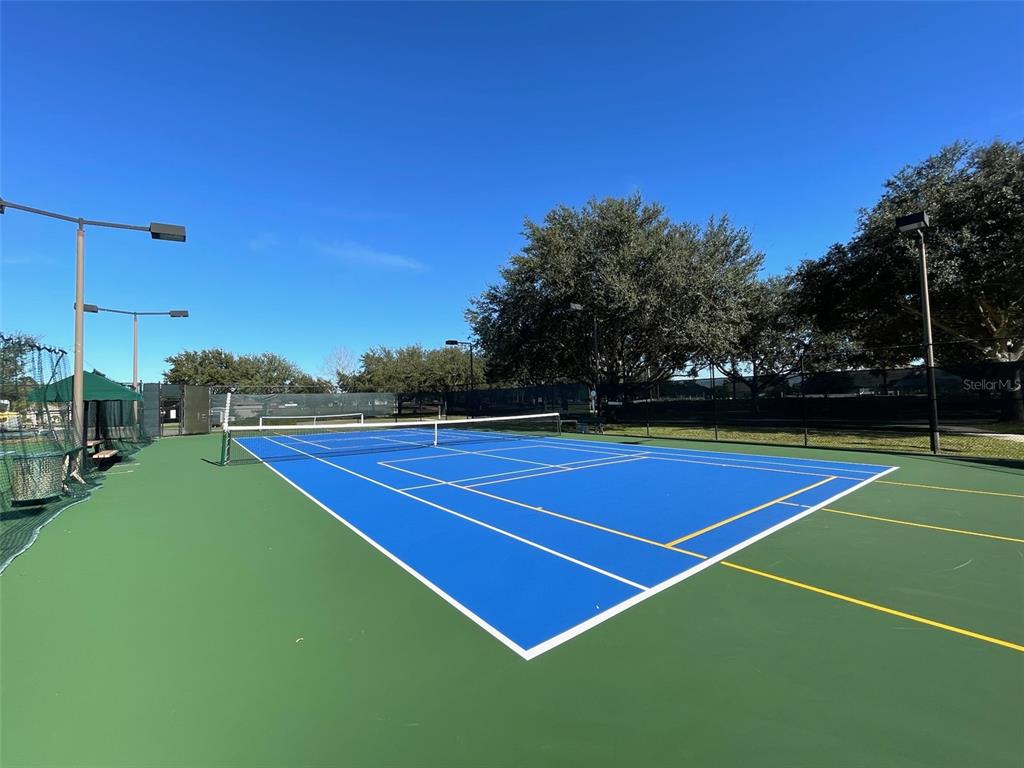 15235 Southwest 14th Avenue Road Ocala, FL 34473 - Photo 48 of 52 a tennis court that has tennis net