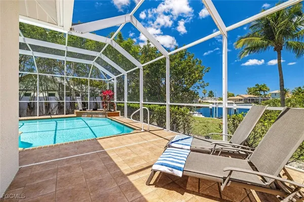 a view of a chairs and table in the patio
