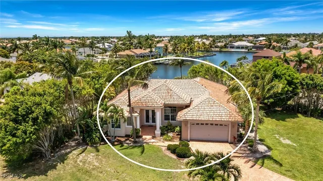 an aerial view of a house with swimming pool outdoor space and mountain view in back