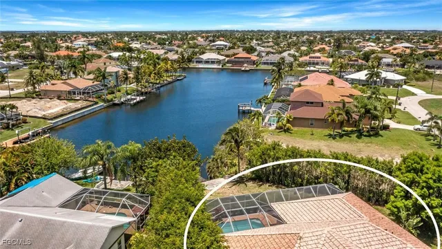 an aerial view of a house with a lake view