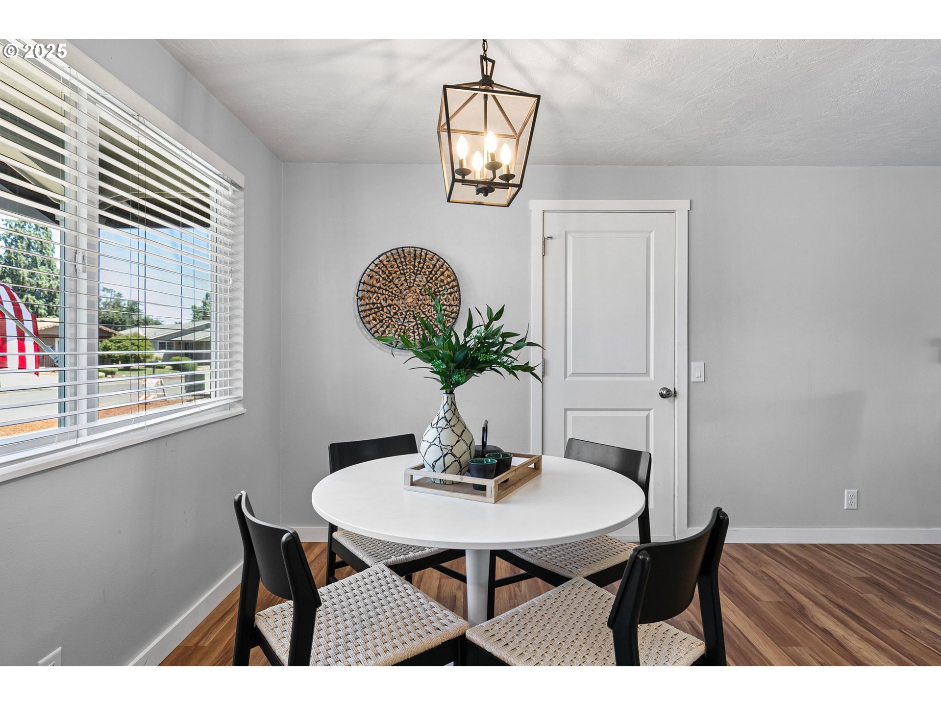 2378 11th Street Springfield, OR 97477 - Photo 13 of 38 a view of a dining room with furniture and wooden floor
