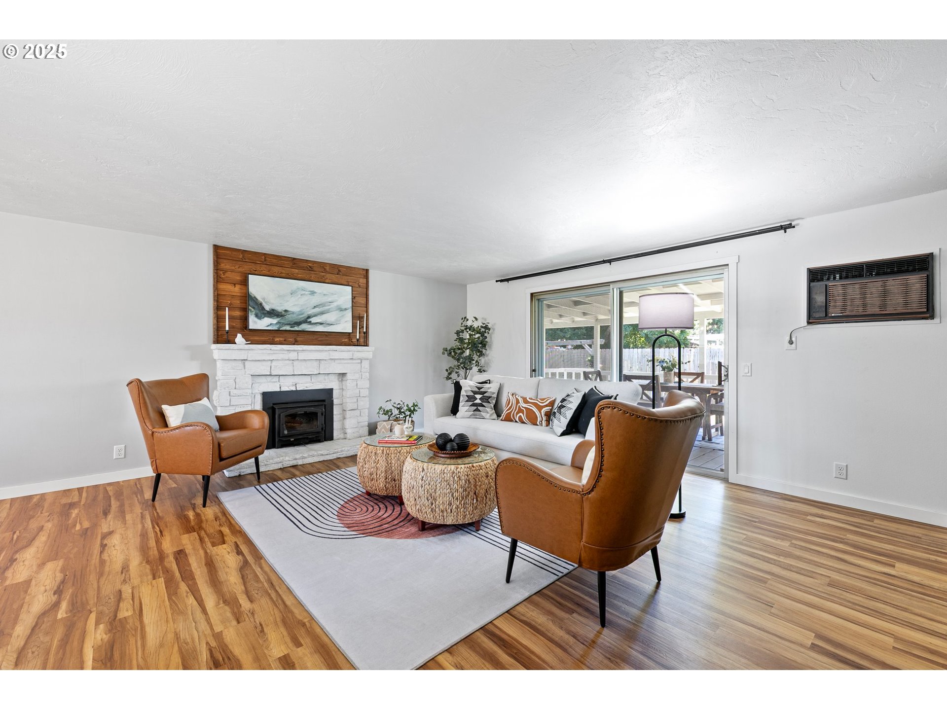 2378 11th Street Springfield, OR 97477 - Photo 18 of 38 a living room with furniture a fireplace and a table