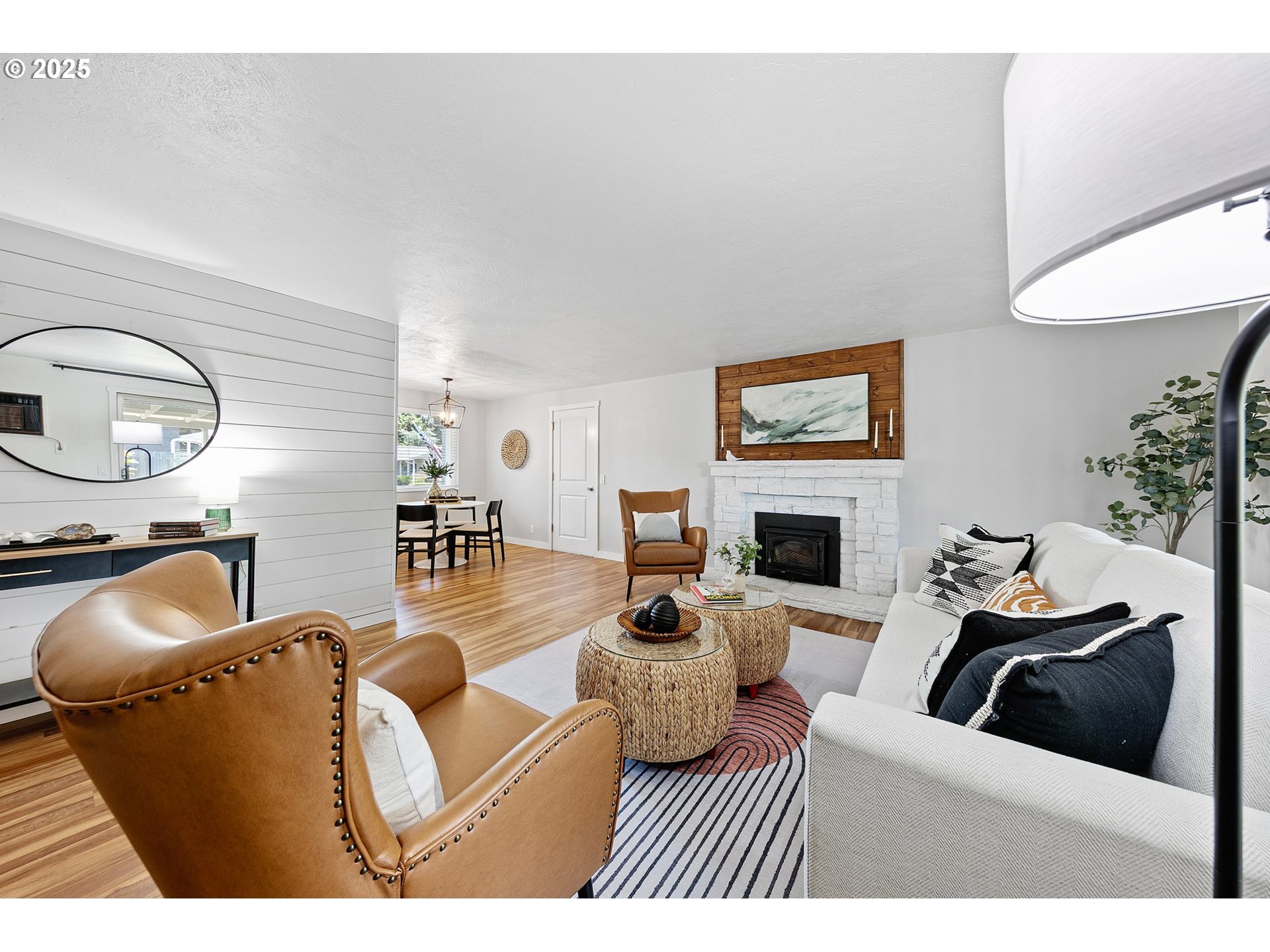 2378 11th Street Springfield, OR 97477 - Photo 20 of 38 a living room with furniture a fireplace and a flat screen tv