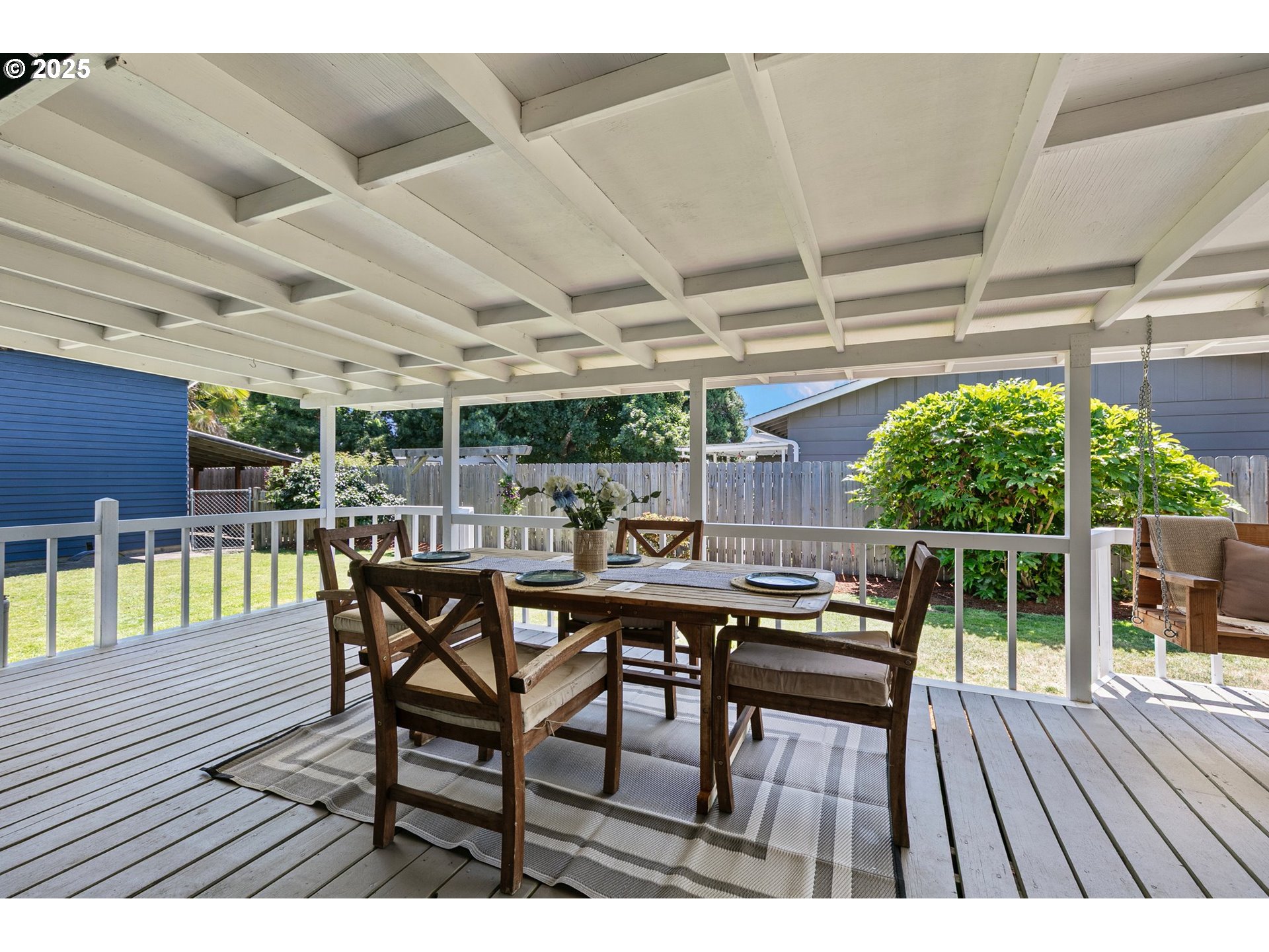2378 11th Street Springfield, OR 97477 - Photo 27 of 38 a view of a backyard with a dining space and wooden floor