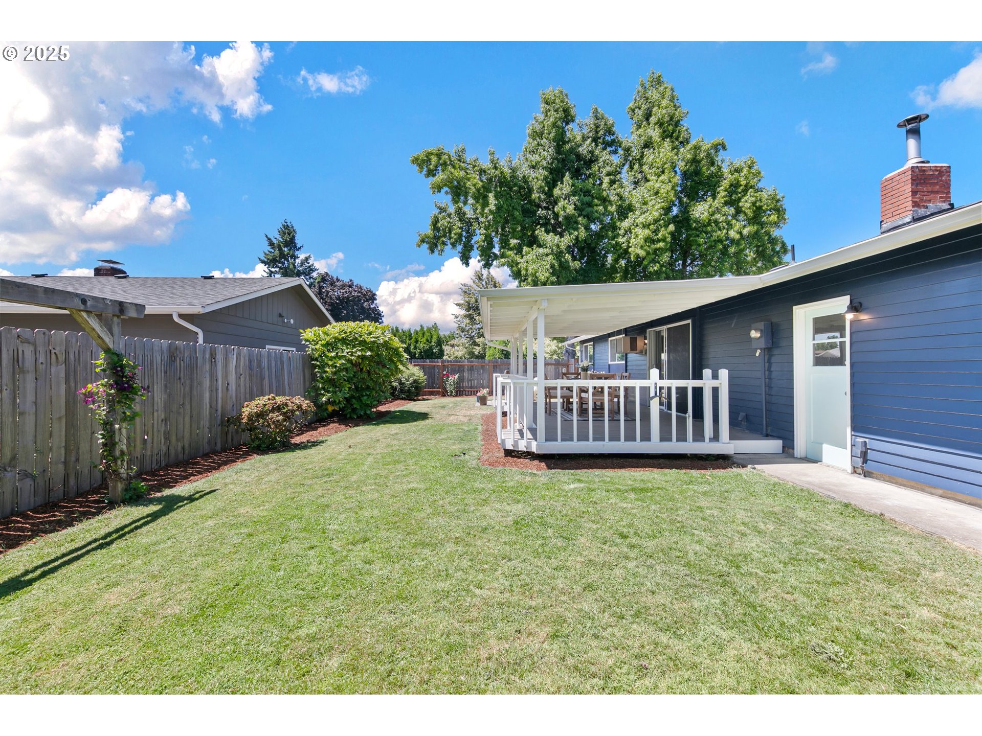 2378 11th Street Springfield, OR 97477 - Photo 30 of 38 a view of a house with a yard and a garden