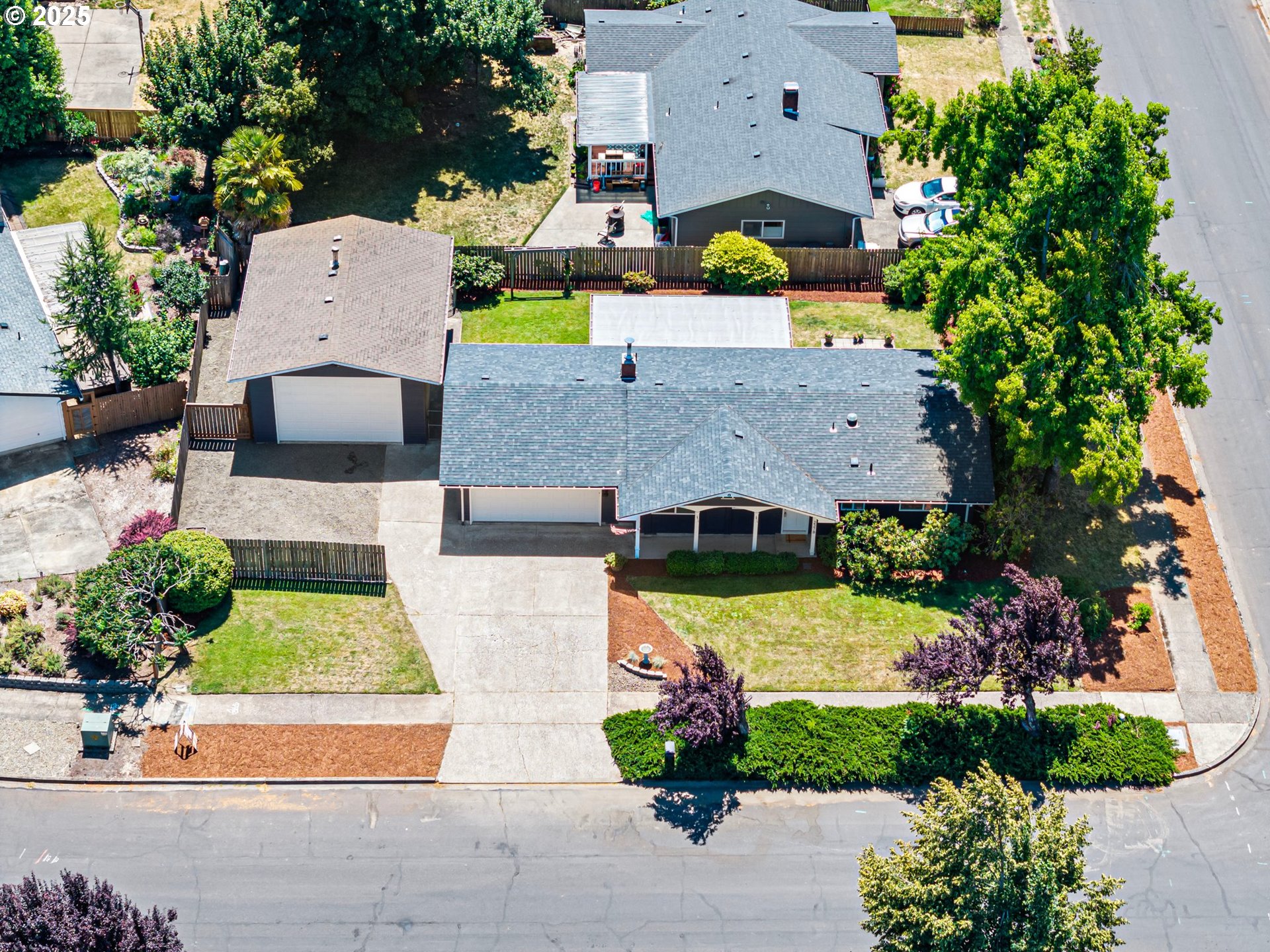 2378 11th Street Springfield, OR 97477 - Photo 36 of 38 an aerial view of a house with a yard and garden