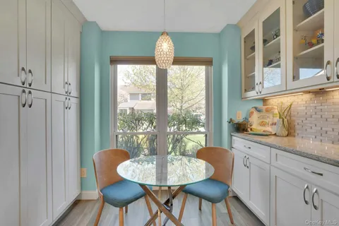 a view of a dining room with furniture window and outside view