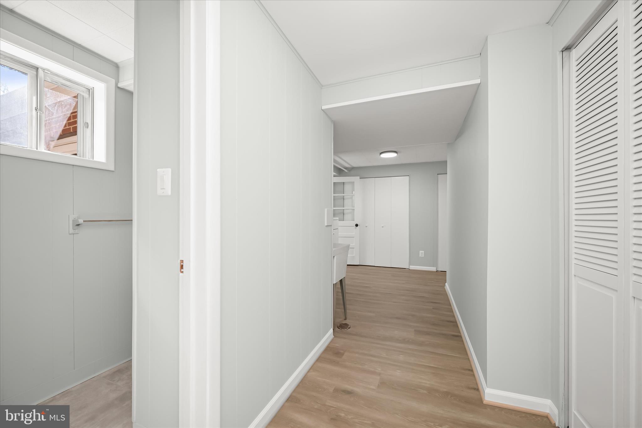 9720 Hedin Drive Silver Spring, MD 20903 - Photo 55 of 79 a view of a hallway with wooden floor and closet
