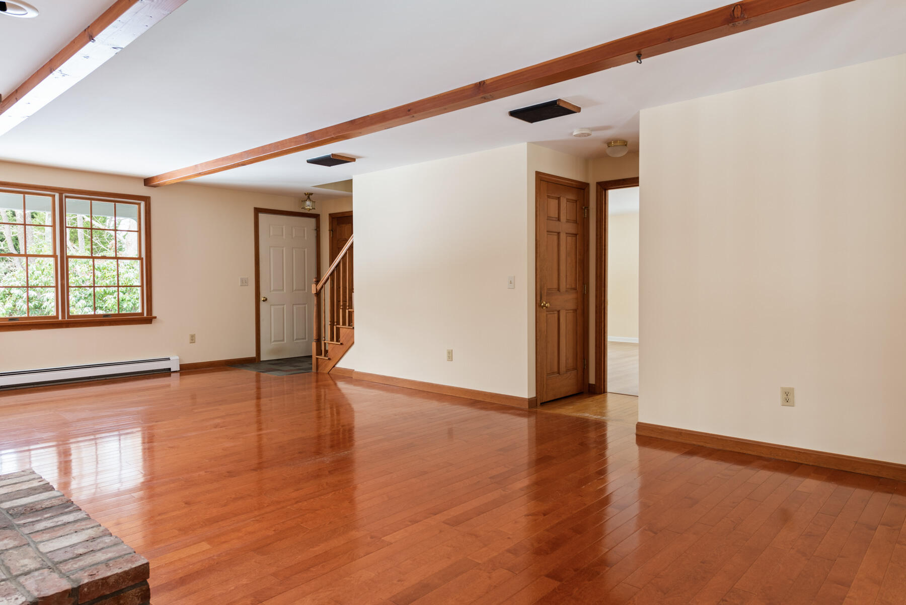 40 Baldwin Road Eastham, MA 02642 - Photo 15 of 37 a view of an empty room with wooden floor and a window