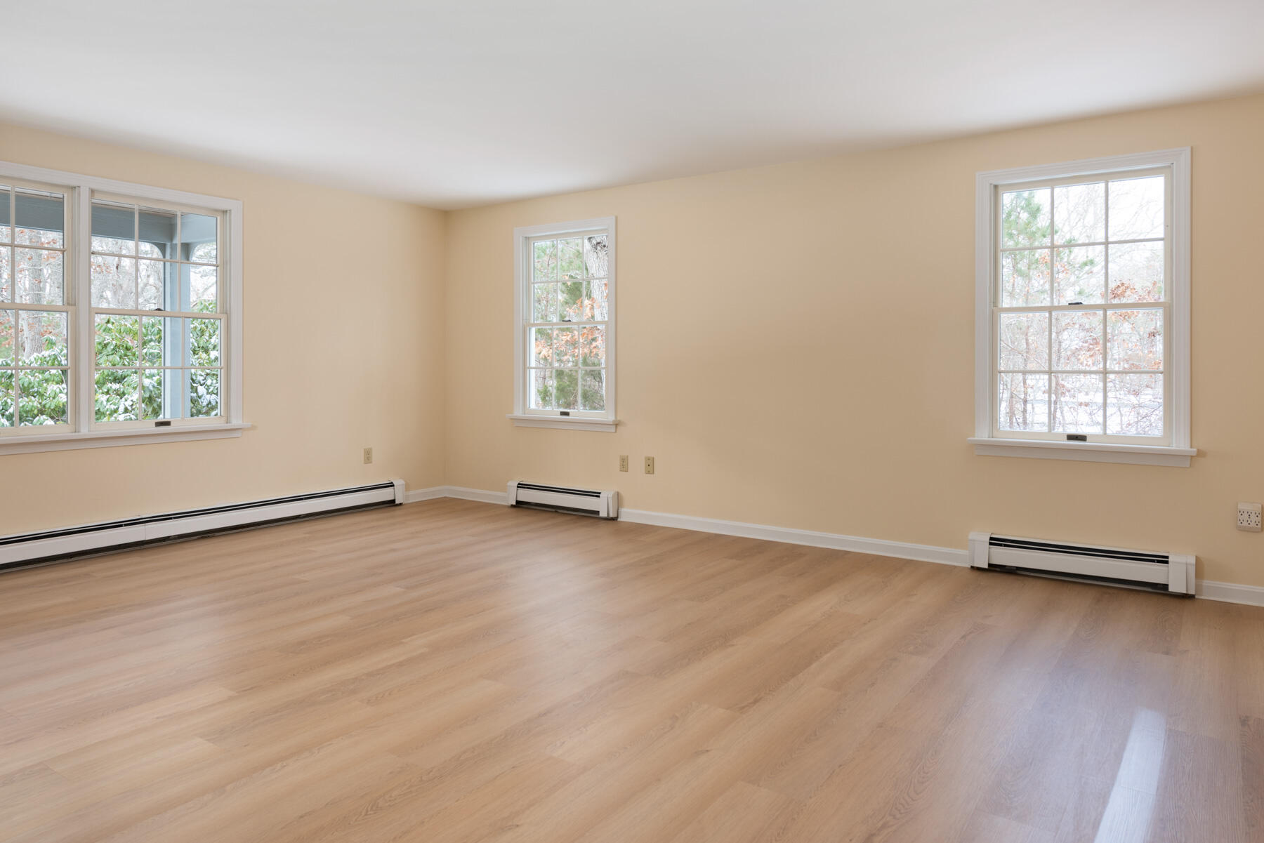 40 Baldwin Road Eastham, MA 02642 - Photo 16 of 37 an empty room with wooden floor and windows