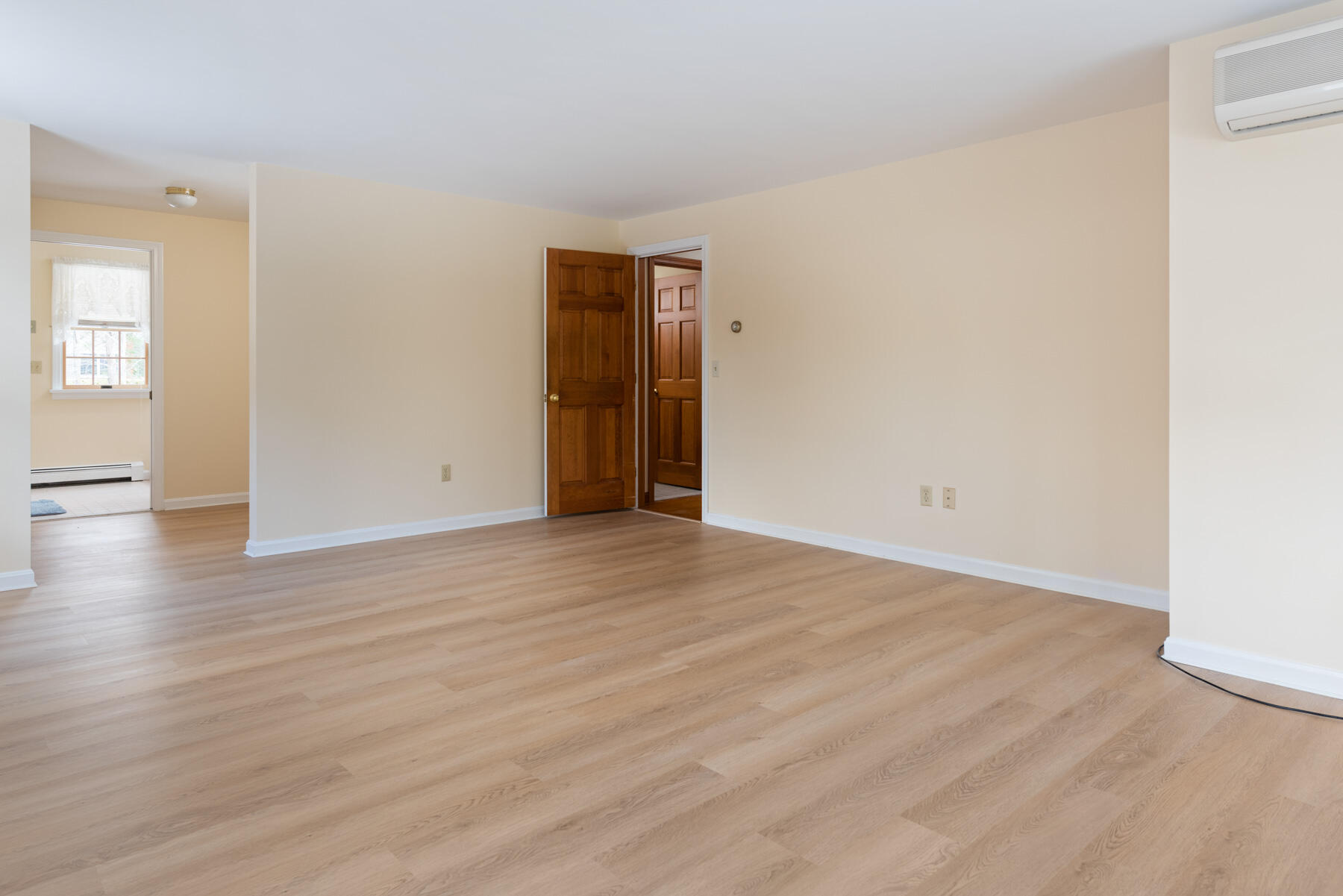 40 Baldwin Road Eastham, MA 02642 - Photo 18 of 37 a view of an empty room with wooden floor and closet