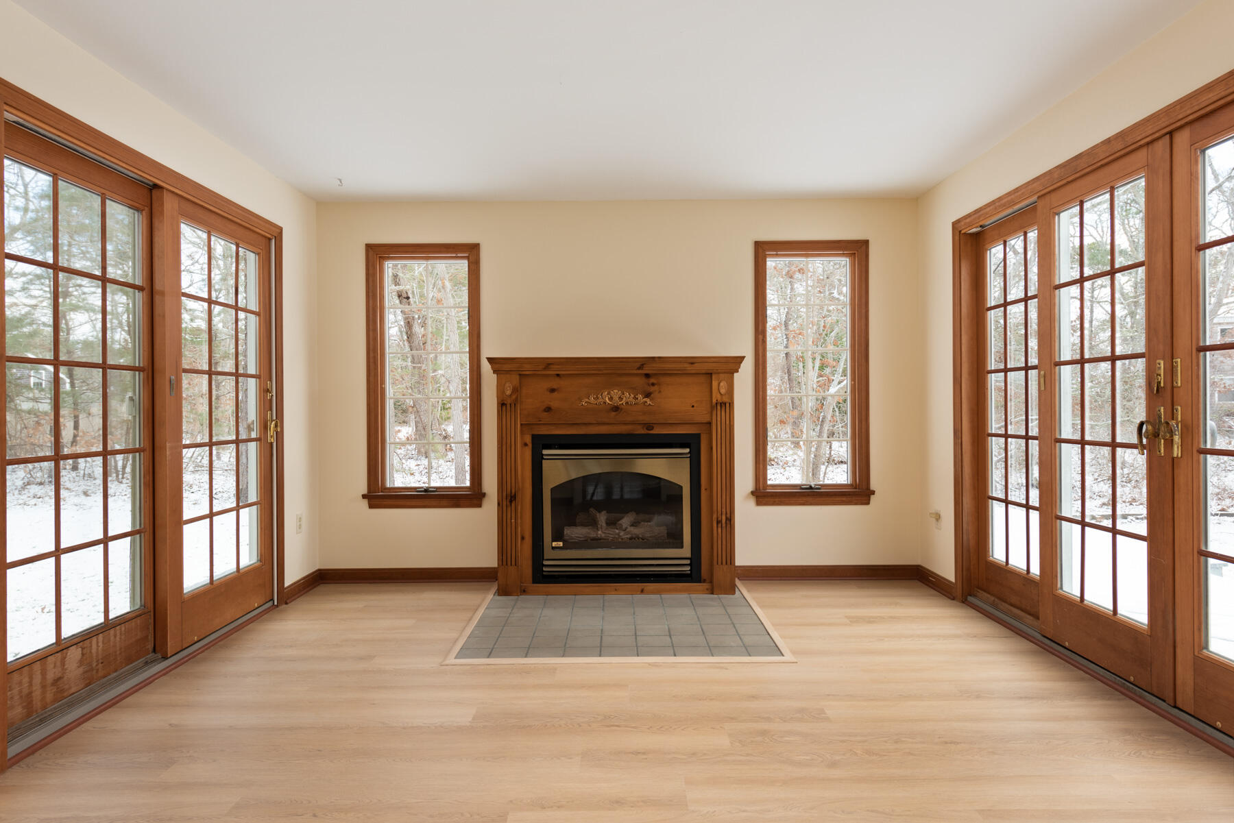 40 Baldwin Road Eastham, MA 02642 - Photo 21 of 37 a view of an empty room with a fireplace and a window
