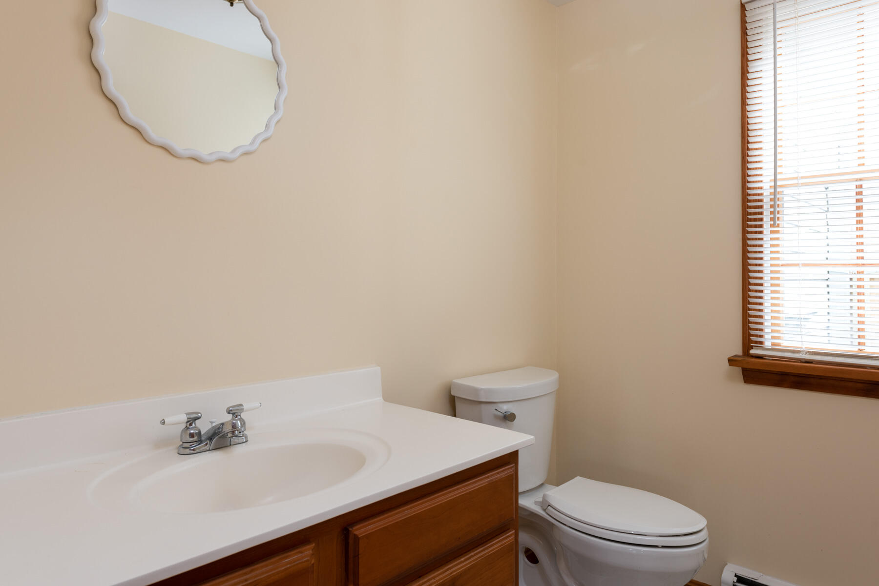 40 Baldwin Road Eastham, MA 02642 - Photo 27 of 37 a bathroom with a sink a toilet and mirror