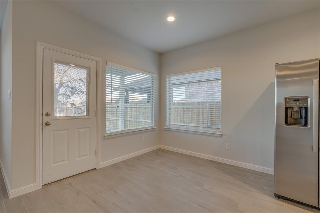 9645 Alderleaf Trail Crowley, TX 76036 - Photo 17 of 33 an empty room with windows