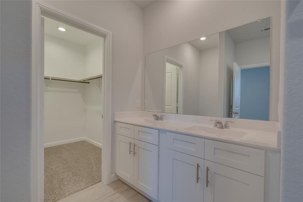 9645 Alderleaf Trail Crowley, TX 76036 - Photo 22 of 33 a bathroom with a double vanity sink and mirror
