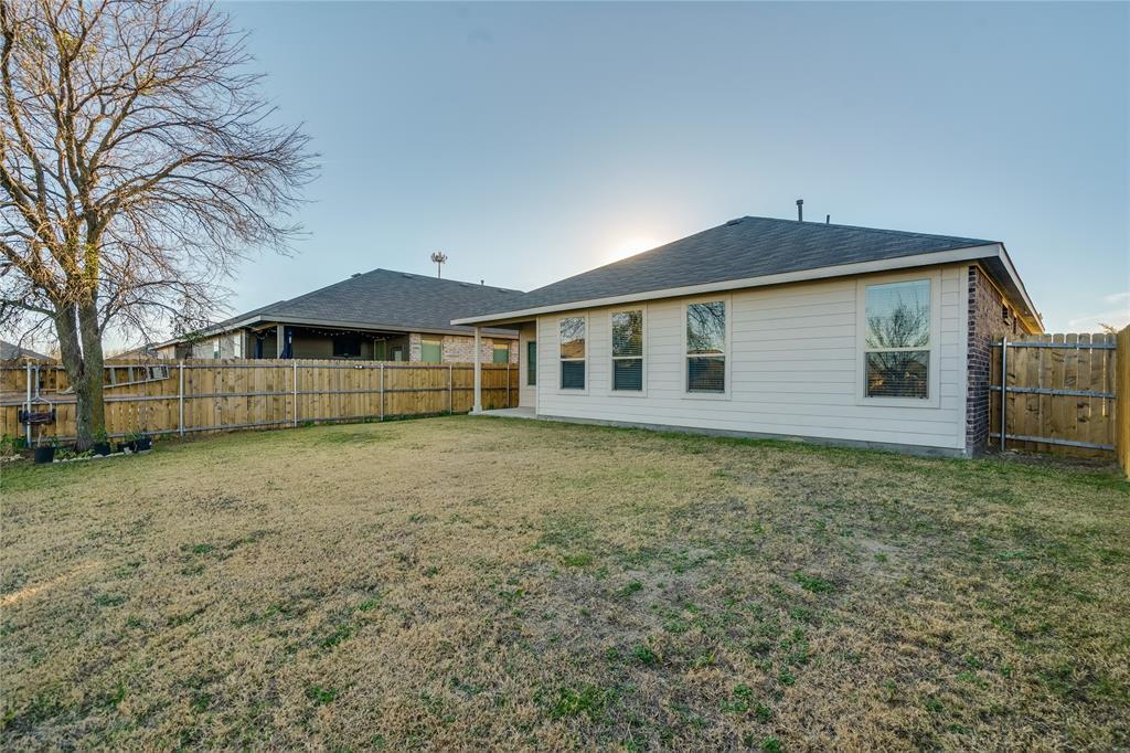 9645 Alderleaf Trail Crowley, TX 76036 - Photo 25 of 33 a front view of a house with garden