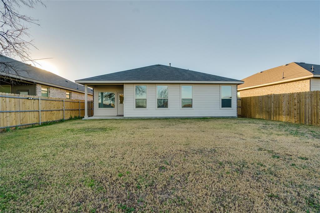 9645 Alderleaf Trail Crowley, TX 76036 - Photo 26 of 33 a view of a house with a backyard
