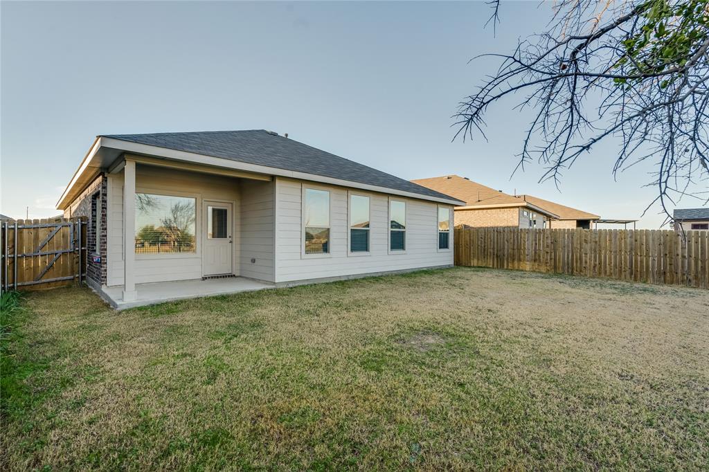 9645 Alderleaf Trail Crowley, TX 76036 - Photo 27 of 33 a view of a house with backyard and garden