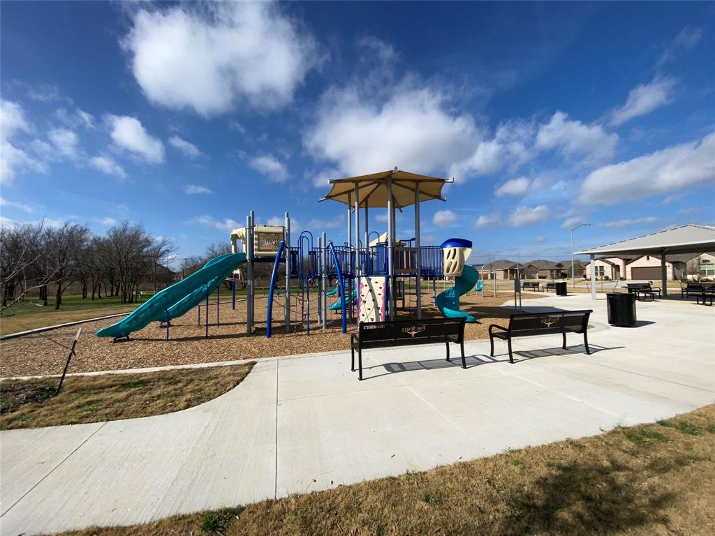 9645 Alderleaf Trail Crowley, TX 76036 - Photo 30 of 33 a view of a swimming pool with a bench