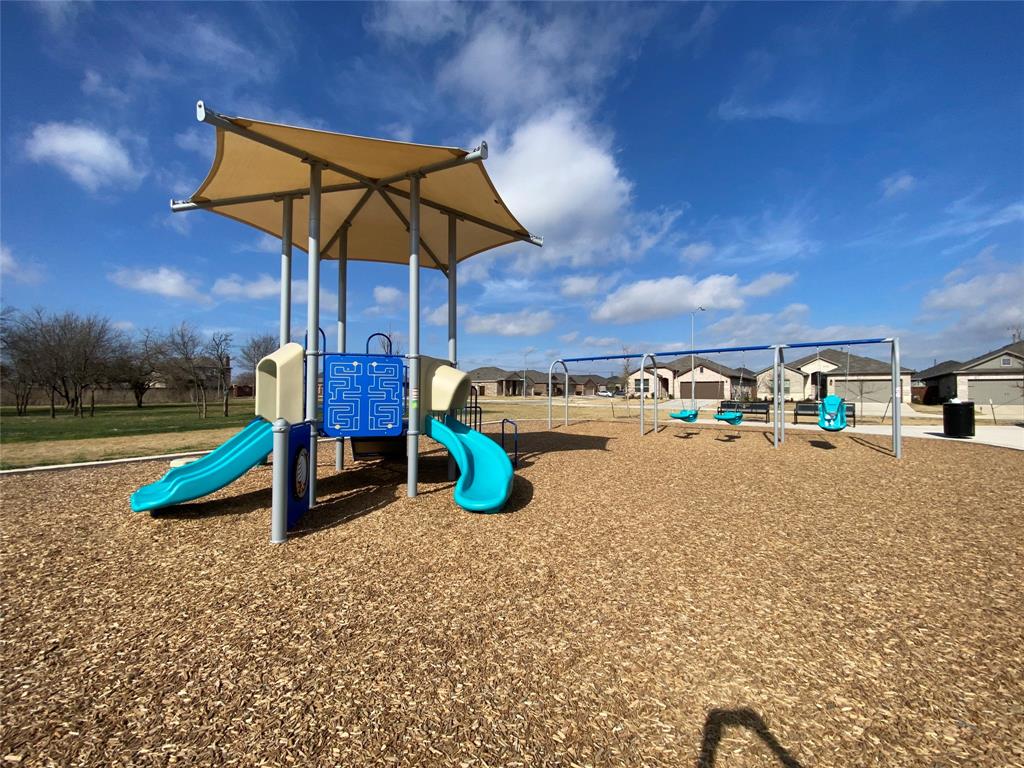 9645 Alderleaf Trail Crowley, TX 76036 - Photo 32 of 33 a view of a swimming pool with a patio