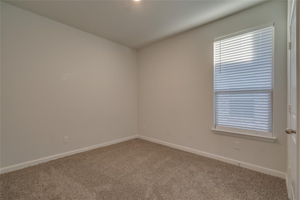 9645 Alderleaf Trail Crowley, TX 76036 - Photo 8 of 33 an empty room with a window