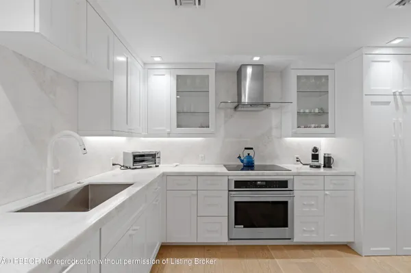a kitchen with a stove and a refrigerator