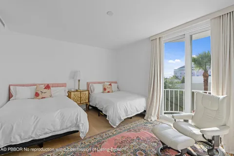 a bathroom with a double vanity sink toilet mirror and shower