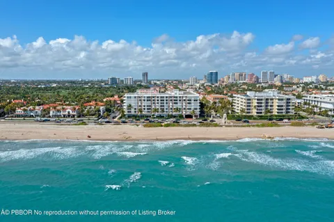 a picture of a bench in front of a wall