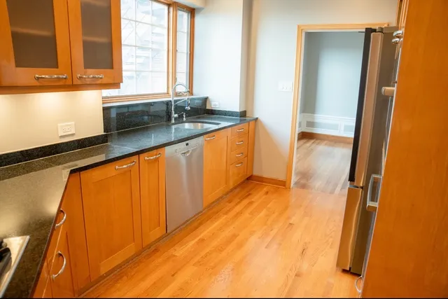 a kitchen with a sink and a window