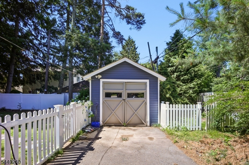10 Mountain Place Montclair, NJ 07043 - Photo 21 of 21 a view of a wooden house with a small yard and wooden fence