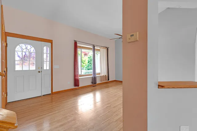 a view of livingroom with hardwood floor and hallway