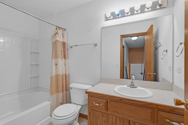 a bathroom with a sink toilet a shower and a mirror