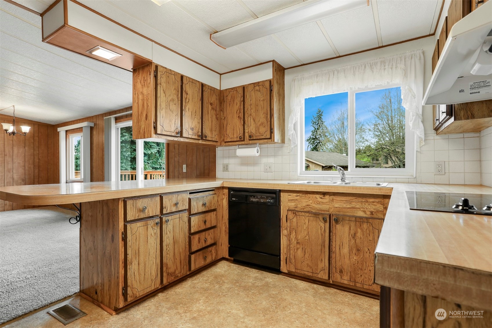 828 Wandering Creek Drive Bothell, WA 98021 - Photo 13 of 40 a kitchen with stainless steel appliances granite countertop a sink and a stove