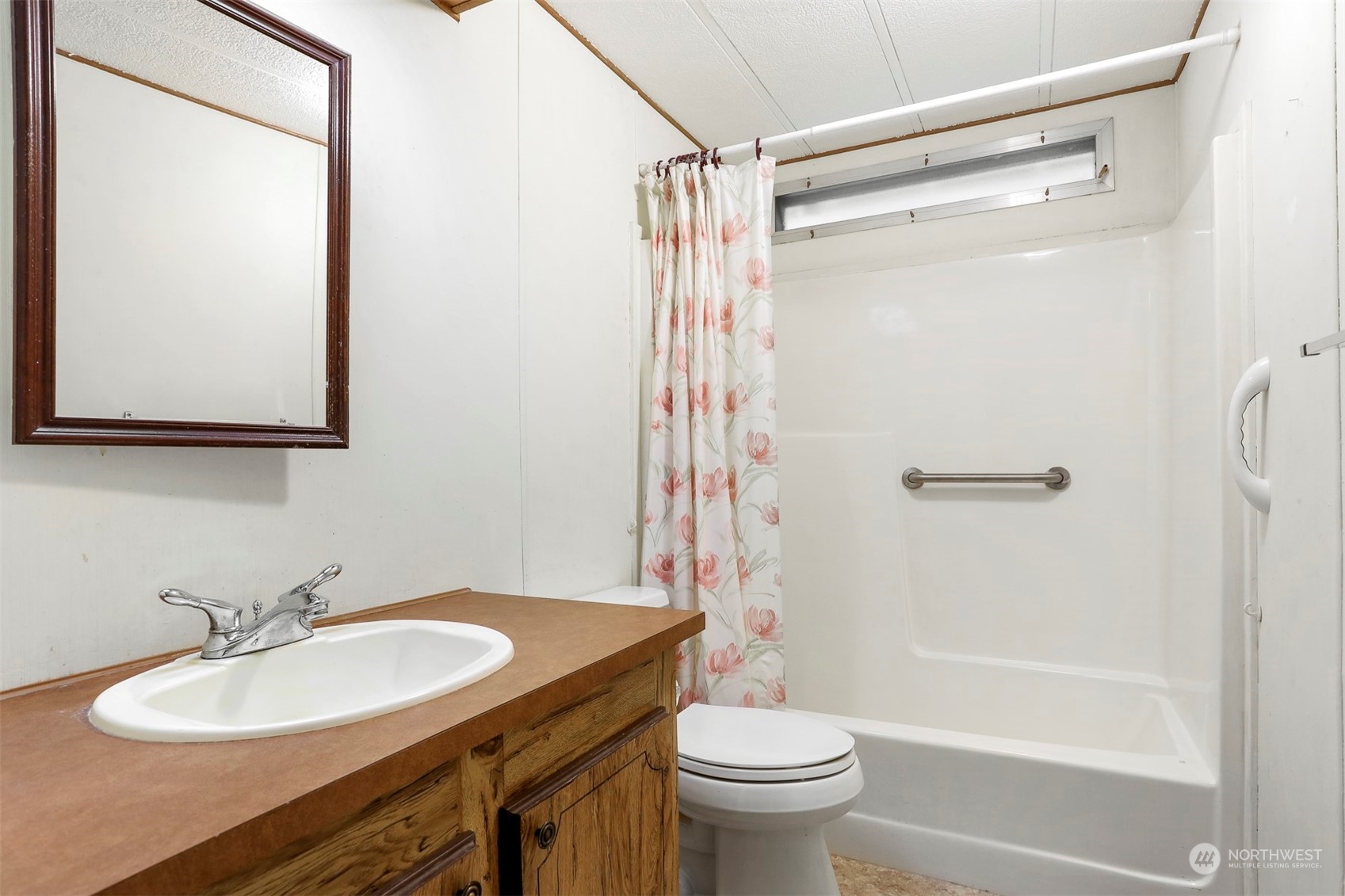 828 Wandering Creek Drive Bothell, WA 98021 - Photo 21 of 40 a bathroom with a sink toilet and shower