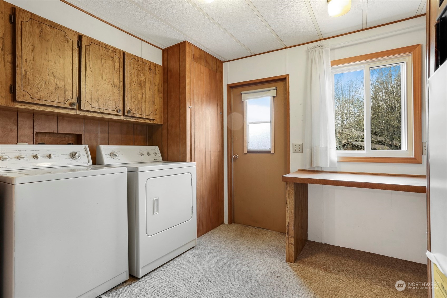 828 Wandering Creek Drive Bothell, WA 98021 - Photo 24 of 40 a utility room with dryer and washer