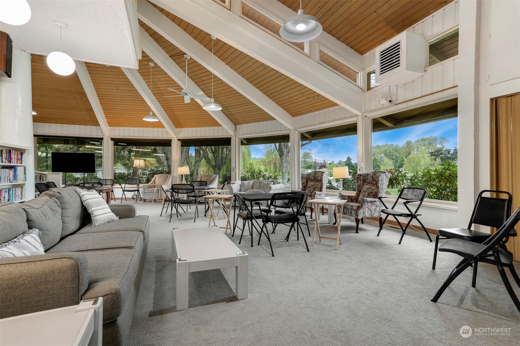 828 Wandering Creek Drive Bothell, WA 98021 - Photo 37 of 40 a living room with furniture a fireplace and lots of tables