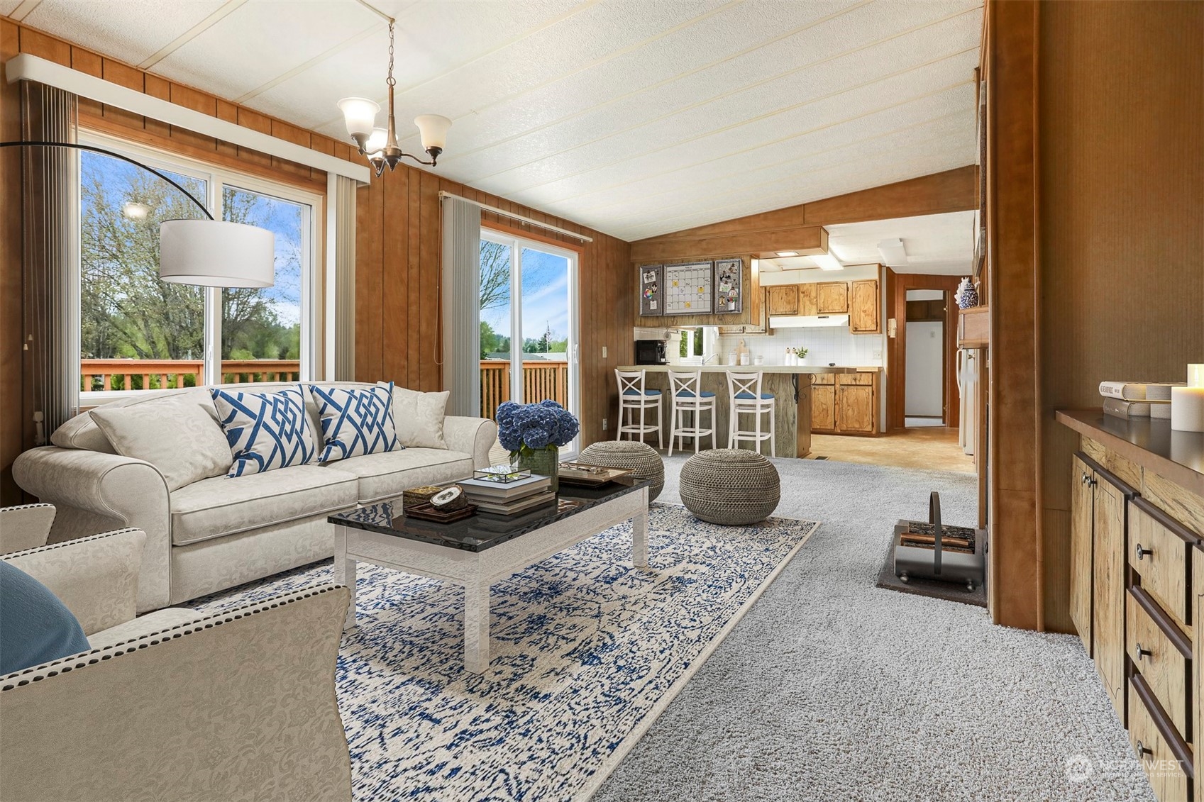 828 Wandering Creek Drive Bothell, WA 98021 - Photo 7 of 40 a living room with furniture and a floor to ceiling window