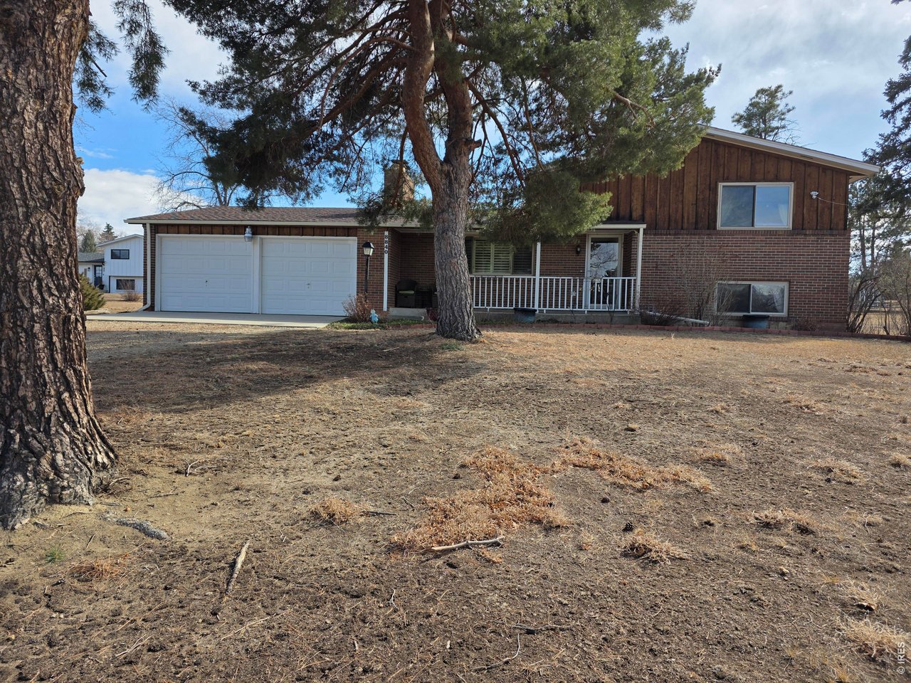 8840 Niwot Road Niwot, CO 80503 - Photo 1 of 34 a view of a house with a yard and garage